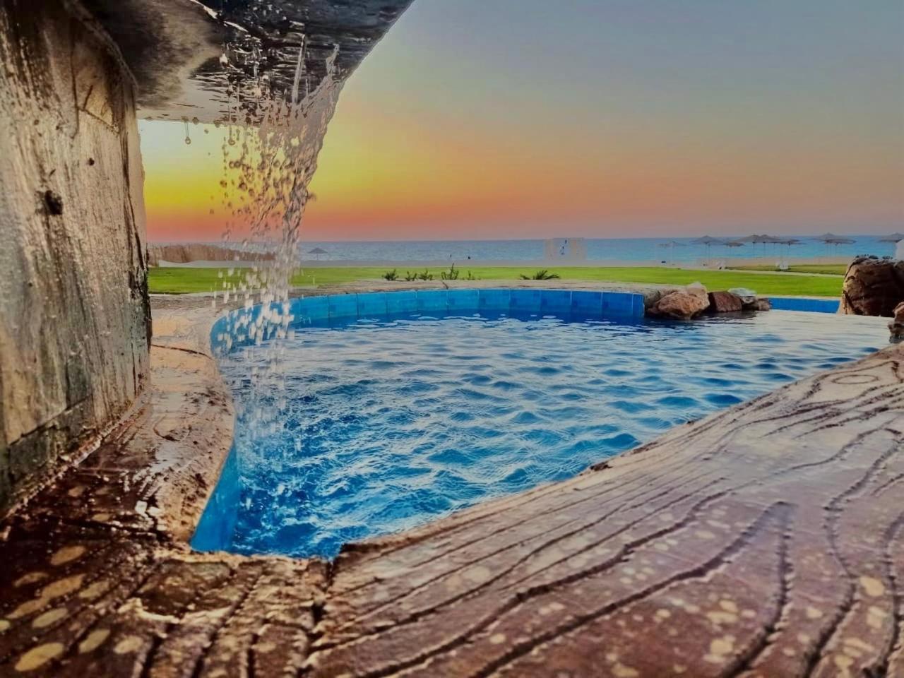 โรงแรมบอร์ก เอล อาหรับ บีช บอร์จเอลอาหรับ ภายนอก รูปภาพ Sunset at the beach
